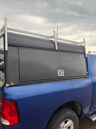 Black 5.5ft locking truck cap. Tallest cap you can get from Leer. Has roof rack and is insulated. $2...