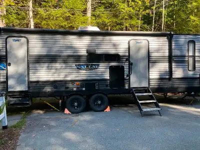 The 26DBUD has double bunks at one end and a queen bedroom at the other. You also get a fireplace (h...