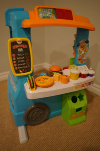 Fisher-Price Laugh and Learn Servin' Up Fun Food Truck toy