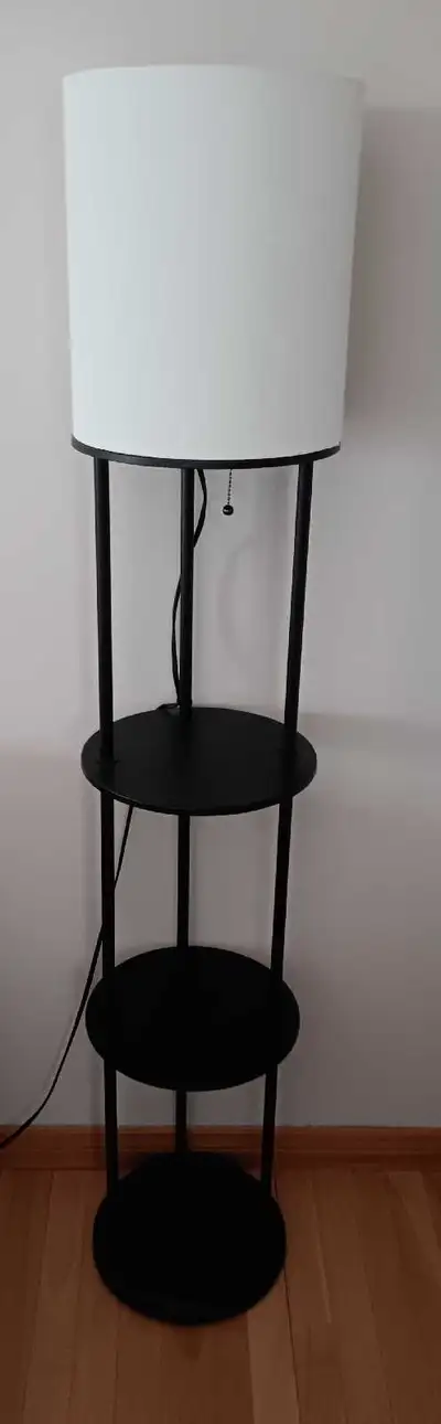 Floor lamp with 2 shelves. 58" tall x 11" diameter. $45 obo Reply through kijiji Cash only Thanks fo...