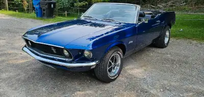 Feast your eyes on this classic 1969 Ford Mustang Convertible, a true American icon. This beauty spo...