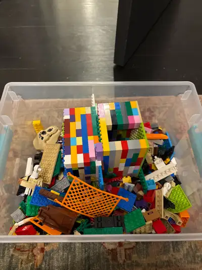 Unleash your inner architect with this vibrant collection of Lego blocks and elements! This used set...