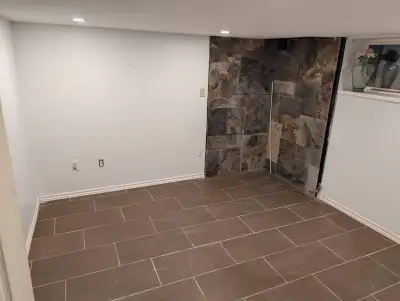 Bright 2 bedroom (the master bedroom has a walk-in closet) basement apartment to rent with kitchen,...