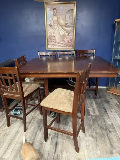 Solid wood Bar Height dining table. Very sturdy and heavy. Chairs are in fair condition. Please text...