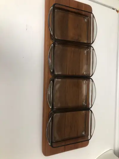 I am selling a brand new ( still in its box) vintage Danish teak and 4 section smoked glass serving...