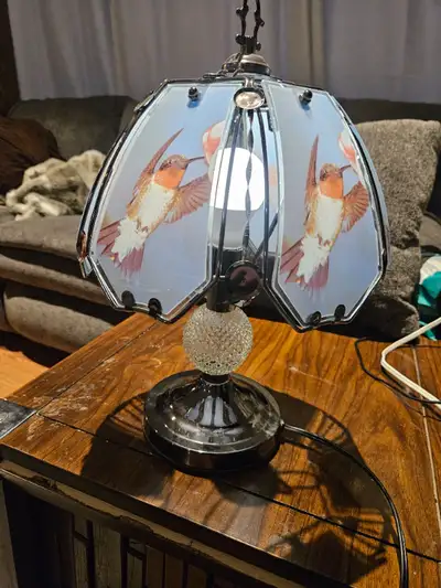 Finicky pretty Tiffany style hummingbird lamp. $30, View more