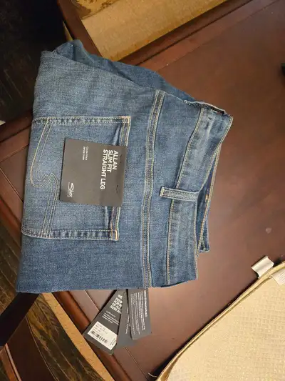Men's silver jeans, brand new with tags. Size 42/32. $50 firm