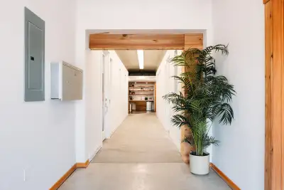 Modern industrial high concrete ceilings and bright finishes make this space feel spacious and airy....