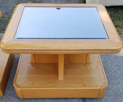 Matching tv stand and table. Mirrored glass tops. Maple finish. Decent shape. $25 obo (for both)
