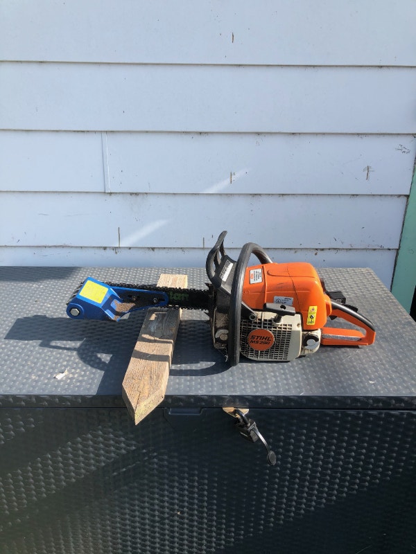 Stihl chainsaw with Log Wizard bark peeling attachment Outdoor Tools