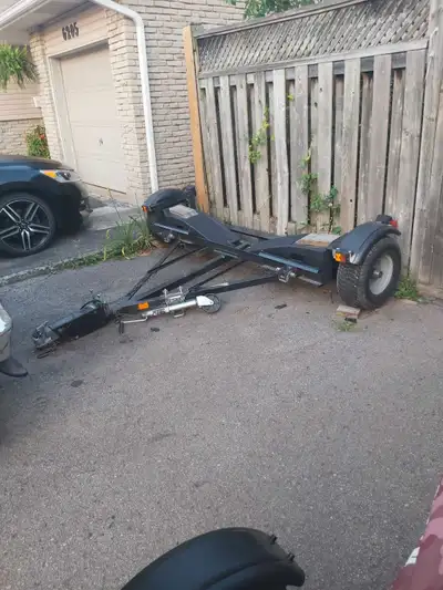 Heavy duty car tow dolly with disc brakes used to tow my small car on camping trips comes with a spa...