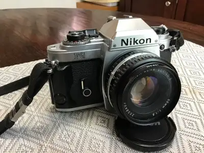 Nikon FG with 50mm f1.8 lens and 70-210mm Zoom lens, View more