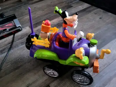 Crank the front watch him spin and sputter he talks and laughs and has a remote control for movement...