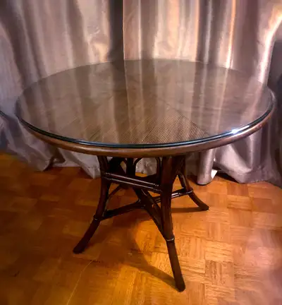 Stylish Wicker Table with glass top - 3’ H x 29.5” D. 2 x Wicker Chairs with comfortable red cushion...