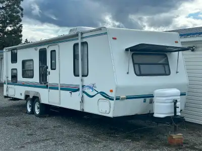 30’ Bumper pull Camper Trailer in good condition. Spacious interior with master bedroom, fold out co...
