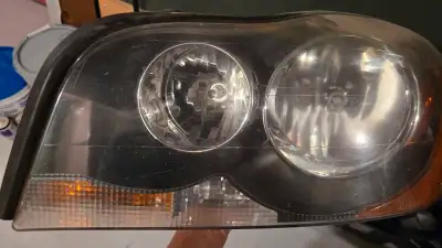 Selling a used 2005 Volvo XC90 headlight, as seen in the photos. It's in good working condition and...
