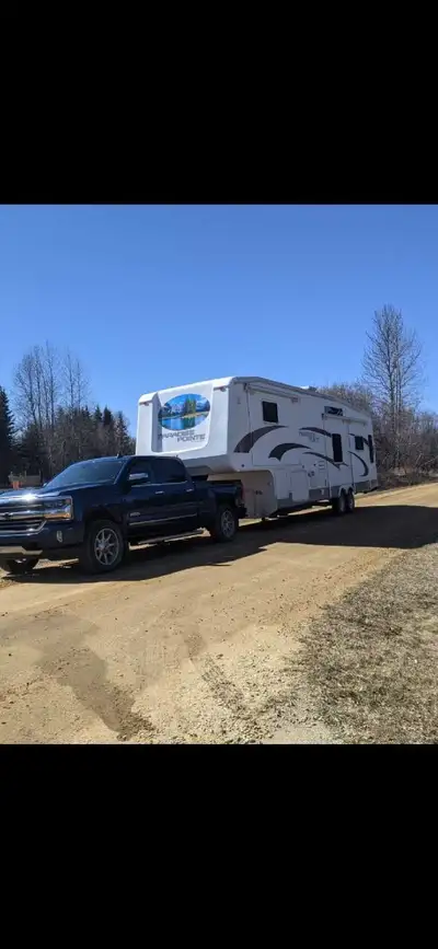 Just over 40 ft over all with four slides opens up very well . Lots of storage . Heated and enclosed...