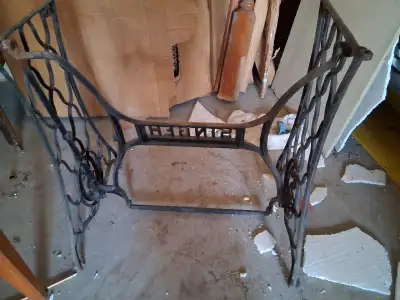 This is a used Singer sewing machine table base, perfect for repurposing into a unique piece of furn...