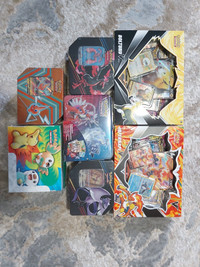 Pokemon sealed boxes and tins