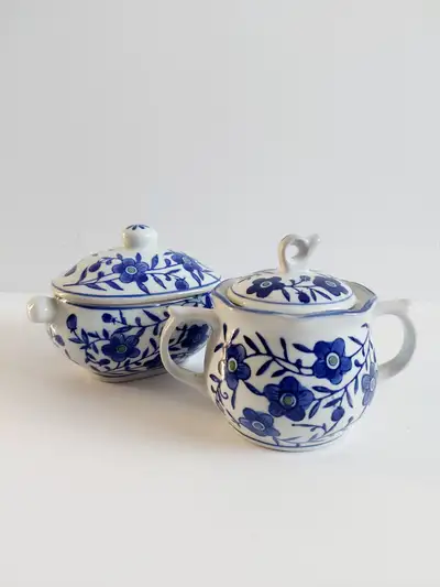 A set of 2 Gryphonware China sugar bowls, View more