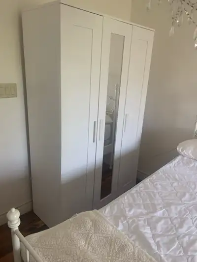 This is an IKEA PAX wardrobe in used condition, perfect for adding extra storage to any room. It fea...