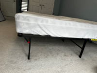 Twin sized mattress and foldable bed frame 
