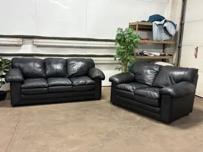 Like new genuine leather black couch and loveseat set. Couch measures 7ft, loveseat measures 5ft. No...