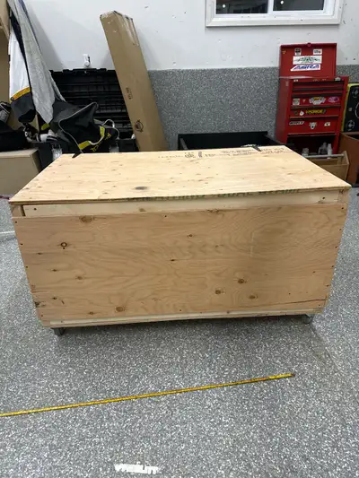 Well built wooden bin on wheels with brand new wood and hinges built with plywood and 2x4 and wheels...
