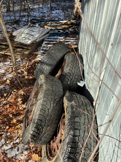 4 Hankook Pike RW 11 winter tires on rusty rims. 215/70R16. Front tires fair. Rear tires good.