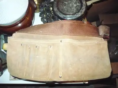 USED DOUBLE RAWHIDE HOLDING POUCH FOR ADJUSTABLE WAISTLINE, View more