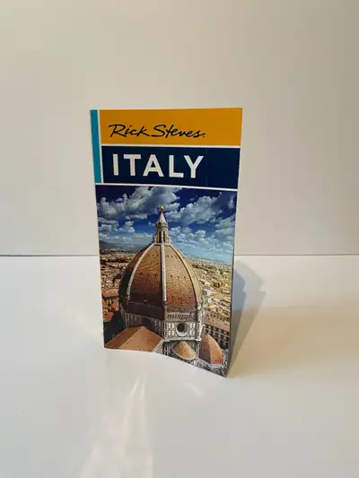 Rick Steve’s Italy travel book. Most recent addition. Includes pocket map for most visited cities. V...