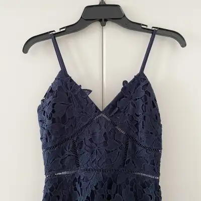 Great condition Size small Approximate measurements: 13.75” pit to pit 34” long Navy blue colour 100...