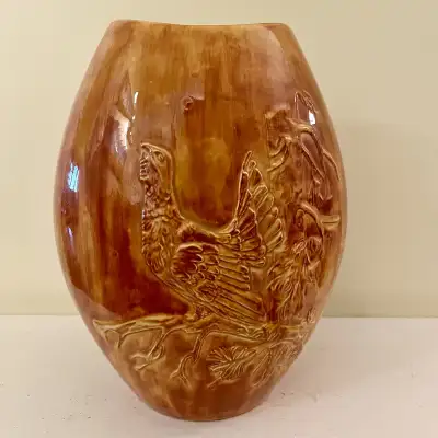 Mid-century Canadian art pottery vase from the maker PQM Canada, characterized by its glossy brown g...