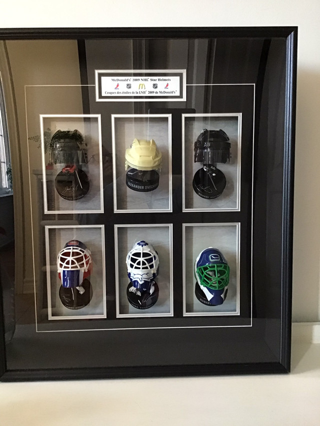 Miniature Hockey helmets (McDonald’s 2009) in a shadow box in Arts & Collectibles in Ottawa