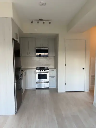 One bedroom and a den with all appliances a balcony on a high floor with beautiful views of Milton a...