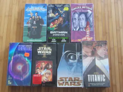 An assortment of sealed VHS tapes are available as follows: 1) Addams Family Reunion 2) Batman Forev...