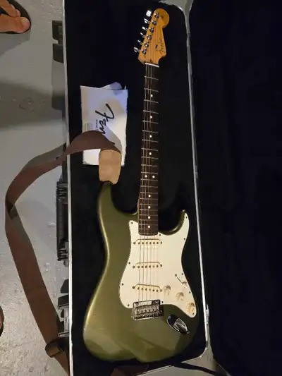 Fender Stratocaster American Standard from 2013 in uncommon forest green. Barely used. Comes with ca...