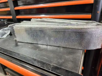 Heat shield covering for use with wire harnesses or hoses. 3 feet long raining from 1 & 1/2 to 2 & 1...