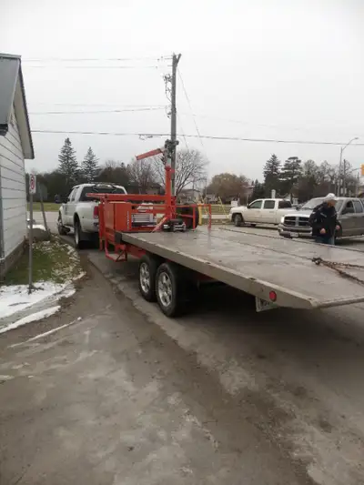 offering my 5th wheel custom tilt deck trailer with winch and a small crane boom for rental must hav...
