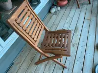 Two Solid teak deck chairs.