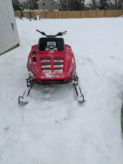 I am offering a '91 Polaris Indy 400L liquid cooled twin snowmobile, a reliable machine for winter f...