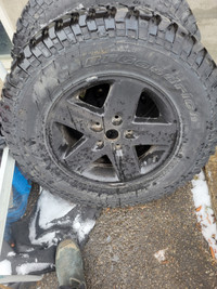 5 Jeep rims and Bf Goodrich baja champion tires lots of tred