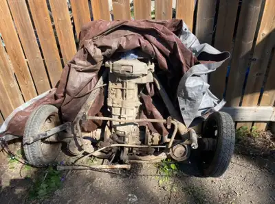 This is a complete transaxle with clutch, axles/half shafts, suspension, brakes, sway bar, springs a...