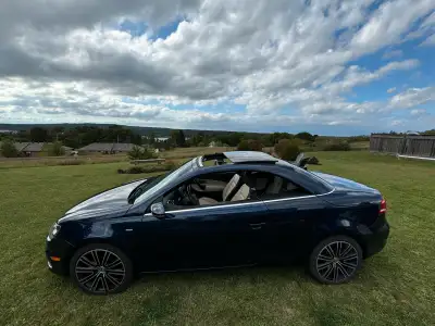 Enjoy the sweet ride of the 2.0 L engine 4 cylinder special Wolfsburg Edition retractable hardtop co...