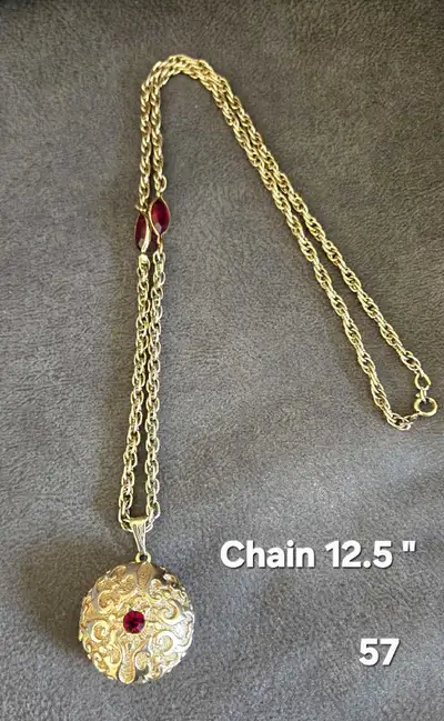 Elegant gold-patterned balm box necklace. Western antique jewelry. Located in Elmwood area for pick...
