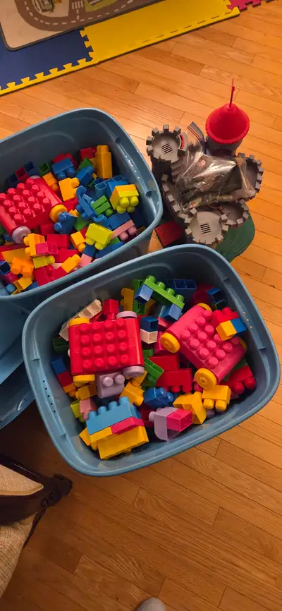 2 bins ( bins included) of mega bloks and a castle with figurines. Located off of 130 ave SE.
