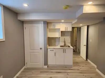In Kitchener- Freshly painted, bright & spacious new bachelor/ studio apartment in basement of legal...