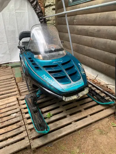 1995 Polaris Indy Trail Touring. Worn but in good condition. ~13,800 km All original parts. Doesn’t...