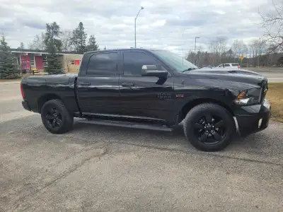 2022 Ram 1500 SLT crew cab with short box. Hemi V8 5.7L engine 4x4. Tinted windows. Black exterior/i...