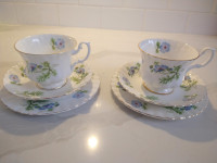 2 tea cups, saucers and bowls